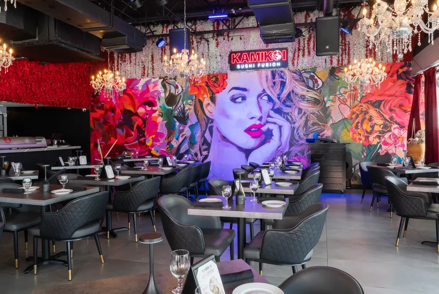 KamiKoi Sushi Fusion dining room styled with chandeliers and set tables for an event