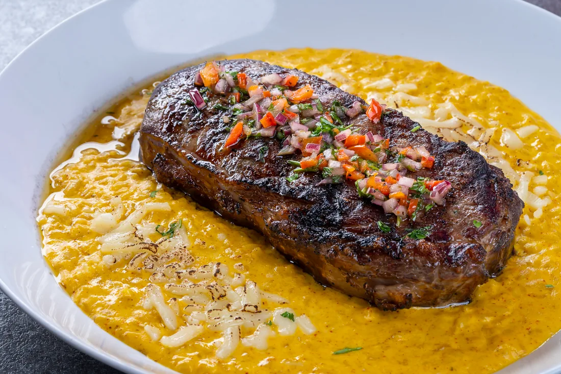 Grilled steak over creamy huancaina risotto at KamiKoi Sushi Fusion in Miami